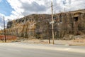 Rock with electric power pole and road in the forefront, North Bergen, New Jersey