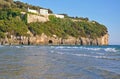 Rock, enclosing a quiet beach in Gaeta