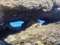 Rock Eyes of the Sea La Ojarada in Cabo de Ajo, Cantabrian Sea, Cantabria, Spain.