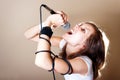 Rock female vocalist on gray background Royalty Free Stock Photo