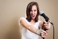 Rock female vocalist on gray background Royalty Free Stock Photo