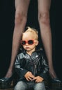 Rock fest. Little rock star. Small boy at female legs. Rock style child. Adorable little music fan. Small child boy in Royalty Free Stock Photo