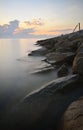 Rock formation at the beach during sunrise on long exposure