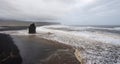 Rock formation on black volcanic beach Royalty Free Stock Photo