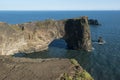 Rock formation in the ocean, Dyrholaey rock arch, Iceland Royalty Free Stock Photo