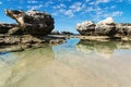 Rock formation an ocean pool with reflections in the sea at Peterborough beach, Victoria, Australia Royalty Free Stock Photo