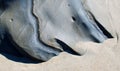 Rock formation in sand in Laguna Beach, California.