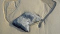 Rock formation in sand at Shaws Cove Beach. in Laguna Beach, California. Royalty Free Stock Photo