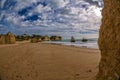 Rock formation and the view on the beach of Tres Irmaos in Alvor, PortimÃÂ£o, Algarve, Portugal, Europe. Praia dos Tres Irmaos