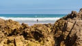 Rock formations in front of Liencres beach on a sunny summer day, Spain. Royalty Free Stock Photo