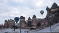 Rock Formations and hot air balloon at Pasabag Valley, Cappadocia.