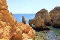 Rock formations jutting out of the Atlantic coastline of Ponta Da Piedade in Lagos