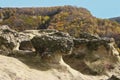 Rock formations, mountains in Caucas, Russia with autumn forest view. Georgeous landscape with cliff and forest. Multicolored yel