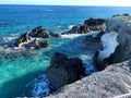 Rock formations in the shallow blue and turquoise water of Bermuda Royalty Free Stock Photo