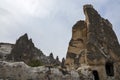 Rock formations of stone houses near the cave city of Goreme in Cappadocia, Turkey Royalty Free Stock Photo