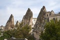 Rock formations of stone houses near the cave city of Goreme in Cappadocia, Turkey Royalty Free Stock Photo