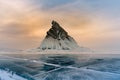 Rock on freeze lake with sunrise sky background