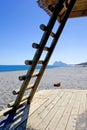 Rock of Gibraltar seen thourgh ladder on Spanish beach