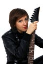 Rock girl in leather outfit with electric guitar Royalty Free Stock Photo