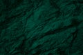 Rock granite texture. Emerald green color. Toned mountain surface. Dark stone background. Royalty Free Stock Photo