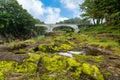 A rock with green moss and waterlogging The foggy morning countryside gives a refreshing atmosphere at Geibikei Royalty Free Stock Photo