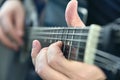 Rock guitarist fingers on guitar strings Royalty Free Stock Photo