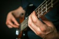 Rock guitarist practicing with bass guitar. Royalty Free Stock Photo