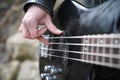 Rock guitarist on the steps. A musician with a bass guitar in a Royalty Free Stock Photo