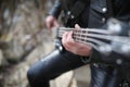 Rock guitarist on the steps. A musician with a bass guitar in a Royalty Free Stock Photo