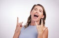 Rock, hand and gesture with woman for celebration in studio or confidence for success, achievement and freedom of Royalty Free Stock Photo