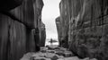 Between a rock and a hard place, man standing between two rock walls