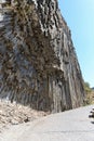 Rock with interesting stone structure above a road in Armenia. Royalty Free Stock Photo