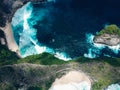 Rock island from Above in Ocean near Nusa Penida Kelingking beach Royalty Free Stock Photo