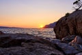Rock island at golden sunset in Brela Royalty Free Stock Photo