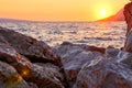 Rock island at golden sunset in Brela Royalty Free Stock Photo