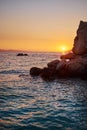 Rock island at golden sunset in Brela Royalty Free Stock Photo