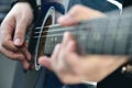 Rock man playing on semi-acoustic guitar Royalty Free Stock Photo