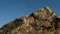 Rock /mountain in front of blue sky.