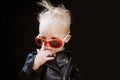 Rock music is a lifestyle. Little child boy in rocker jacket and sunglasses. Rock style child. Rock and roll fashion Royalty Free Stock Photo