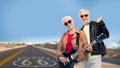 Senior couple with guitar over route 66 Royalty Free Stock Photo