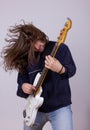 Rock musician with expression playing electric bass guitar Royalty Free Stock Photo