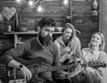 Rock musician with long beard and tattooed arm playing guitar. Bearded man with stern eyes looking at camera. Guitarist Royalty Free Stock Photo