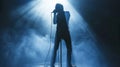 Rock musician singer holding a microphone standing on stage singing. Blue smoke clouds. Dynamic emotional image Royalty Free Stock Photo