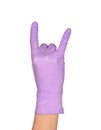 The Rock N` Roll Hand Sign. Hand in a purple latex glove isolated on white. Woman`s hand gesture or sign isolated on white