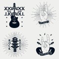 Rock-n-roll prints for t-shirt. Set of graphic design for clothes, t-shirt, apparel with guitar, lightning, ribbon, sunburst. Royalty Free Stock Photo