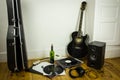 Rock'n'roll setup with ukulele, acoustic guitar, speaker, vinyl Royalty Free Stock Photo