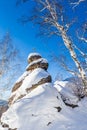 A rock with an Orthodox cross. Mountain Church. Resort Belokurikha, Altai, Russia