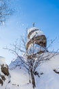 A rock with an Orthodox cross. Mountain Church. Resort Belokurikha, Altai, Russia