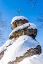 A rock with an Orthodox cross. Mountain Church. Resort Belokurikha