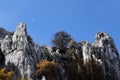 Rock outcroppings in autumn, with the moon Royalty Free Stock Photo